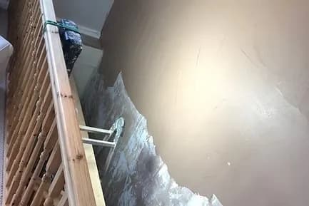 Fresh skim coat plastering around a chimney breast opening